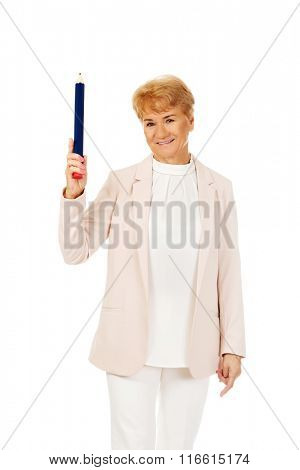 Smile elderly woman pointing up with hege pen