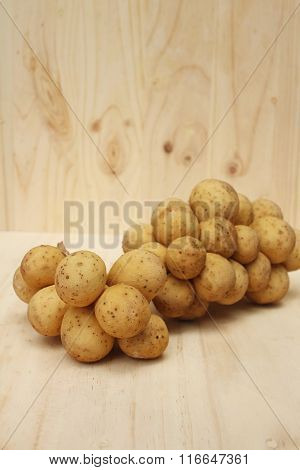 Longkongs On A Background Of Brown Wood.