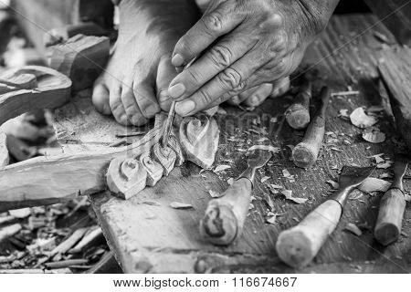Hand Of Carver Carving Wood In Blackand White Color Tone