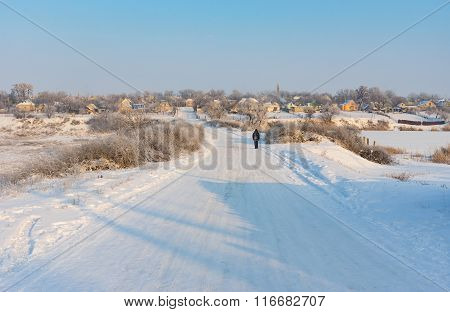 Landscape with winter street in urban-type settlement