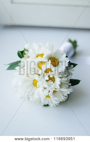 Wedding bouquet of camomile on a white background