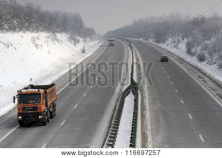Bucharest Romania 23 January 2016: Cars and lorries are passing the high-speed A2 the main commercial route which connects Bucharest to the Black Sea's port Constantza.