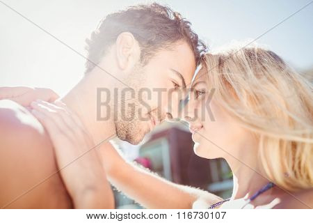 Cute couple hugging by the pool