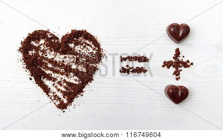 Love Formula Concept. Two Chocolate Candies Make Big Love For Chocolate