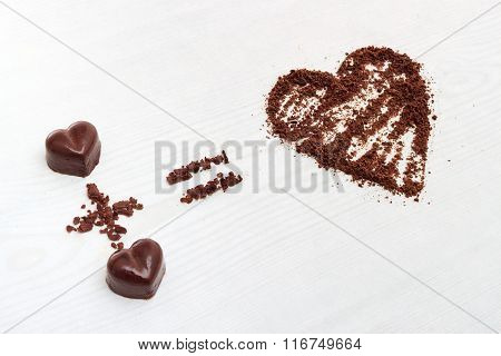 Love Formula Concept. Two Chocolate Candies Make Big Love For Chocolate