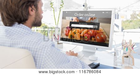 Desinger working on his computer against food app
