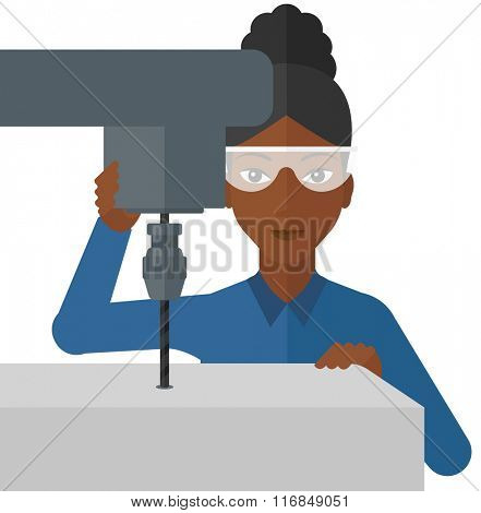 Woman working with boring mill.