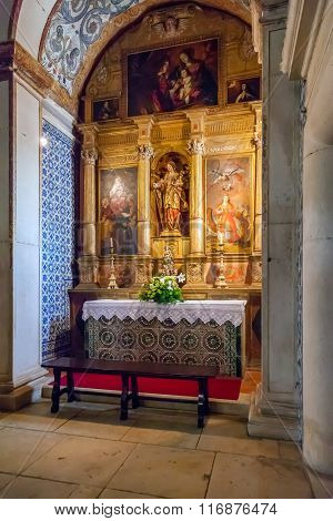 Obidos, Portugal - August, 2015: Saint Catherine Chapel with an altarpiece inside the medieval Santa Maria Church. Obidos is a medieval town inside walls, and very popular among tourists.