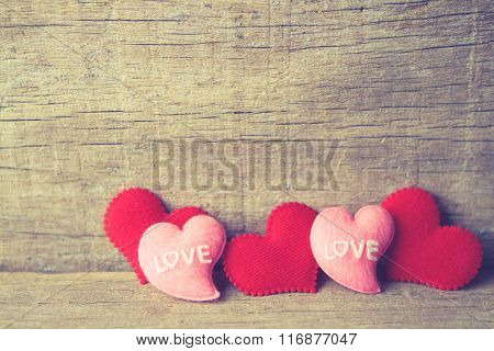 Valentines Day Background With Red And Pink Hearts On Wooden Background. Vingtage Tone.