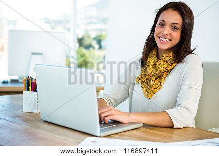 Young girl uses his computer in an office