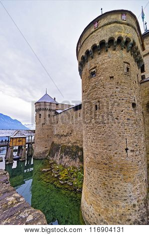 Front Towers Of Chillon Castle On Lake Geneva Of Switzerland