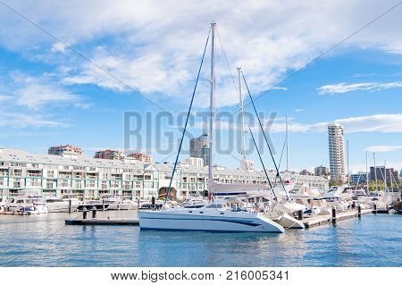 Yachts at berth at famous Woolloomooloo wharf on sunny day in Sydney Australia