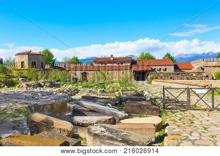 Panorama view of Alaverdi orthodox monastery in Kakhetia region in Georgia and snow peaks of Caucasus mountains
