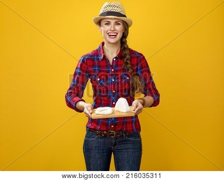 Smiling Modern Woman Grower Showing Trey With Soft White Cheese
