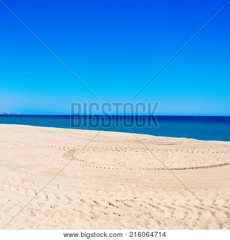 Sea Beach and Soft wave of blue ocean. Summer day and sand background. Colorful boat and empty beach