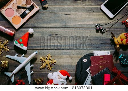 Flat lay of Merry Christmas and Happy new year and any holidy travel concept. Women's accessories to travel Christmas and Happy new year concept background.
