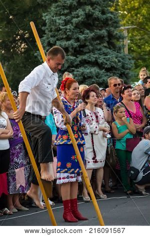 Unknown People Enjoy On The Beach Of Azov Sea