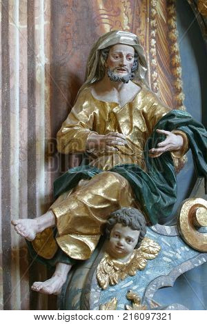 BELEC, CROATIA - NOVEMBER 17: Saint Matthew the Evangelist statue on the pulpit in the Baroque Church of Our Lady of the Snow in Belec, Croatia on November 17, 2011.