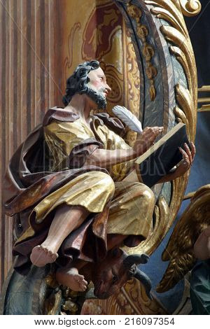 BELEC, CROATIA - NOVEMBER 17: Saint Luke the Evangelist statue on the altar in the Baroque Church of Our Lady of the Snow in Belec, Croatia on November 17, 2011.