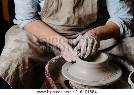 Pottery, Workshop, Ceramics Art Concept - Closeup On Male Hands Sculpt New Utensil With A Tools And 