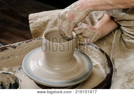 Pottery, Workshop, Ceramics Art Concept - Closeup On Male Hands Sculpt New Utensil With A Tools And 