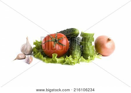 Cucumber with tomatoes on a white background. Vegetables on a white background. Fresh multicolored vegetables on a white background. Tomato with onions and cucumbers on a white background.