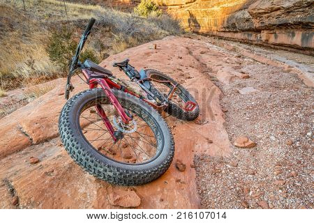 fat bike on a slickrock at the sandstone canyon bottom - Ruby Wash in Red Mountain Open Space north of Fort Collins, Colorado