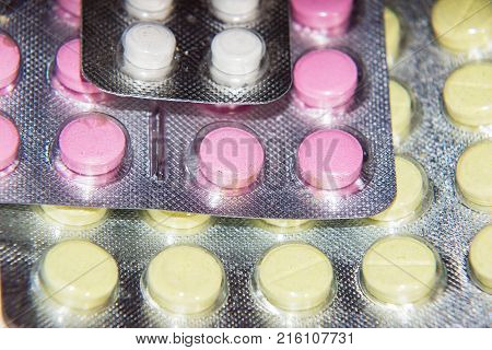 Pharmaceutical tablets and capsules in packages in assortment