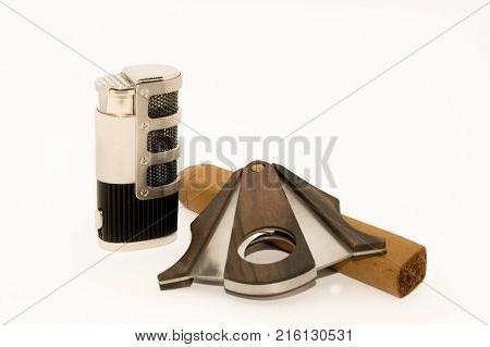 Metal Lighter and cigar cuter on white backdrop