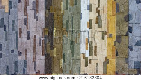 Decorative brick wall from concrete facing tiles as background or texture.