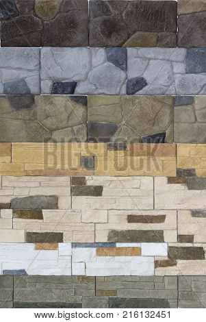 Decorative brick wall from concrete facing tiles as background or texture.