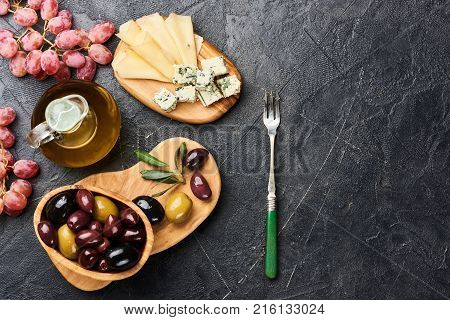 Italian snacks food with Cheese, Olives, Oil with copy space. Top view.