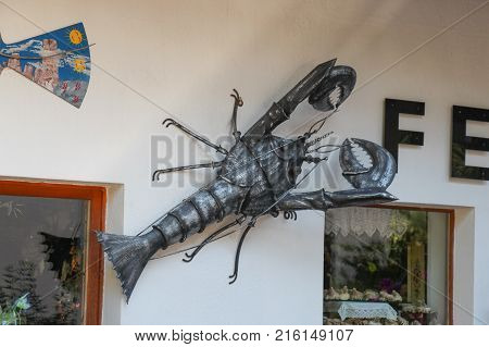 Italy Rocca Pietore - August 26 2016: the view of the decorative ironwork sculpture butterflies on a wall on August 26 2016 Veneto Italy.