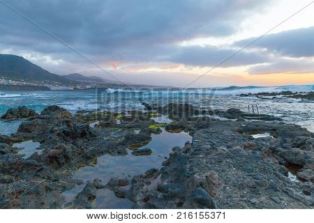 Punta del Hidalgo rock beach at sunset panoramic view Bajamar village Tenerife island