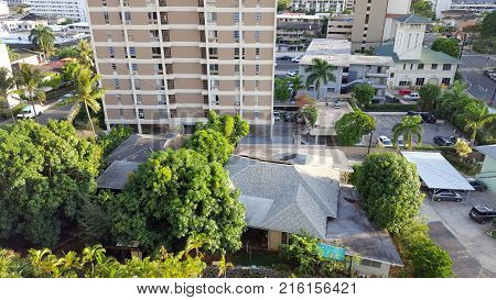 Aerial of Maikiki Neighborhood of houses condominiums and Fire station in Honolulu Hawaii.