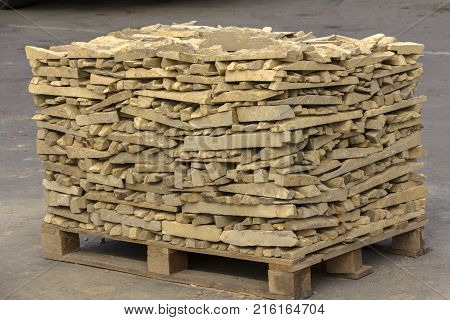 decorative building stone on a pallet can be used for advertising.