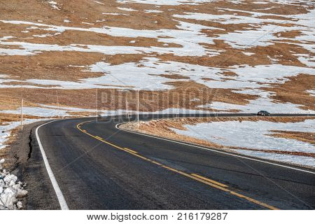 Trail Ridge Road, the highest (12,183 feet) continuous highway in the USA in high alpine tundra with rocks and mountains at autumn. Rocky Mountain National Park in Colorado, USA. 