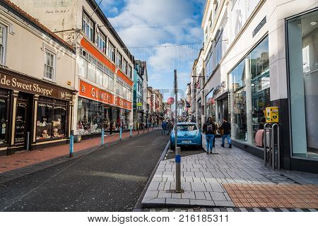 Cork, Ireland - November 12, 2017: Oliver Plunkett street in Cork. It is typical shopping street in the center of Cork