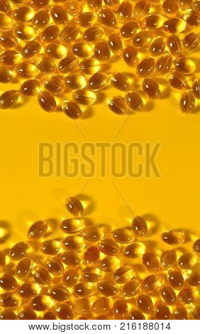 Omega 3 fish fat oil capsules as background texture