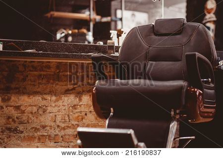 Barber shop. Barbershop little boy getting his head shaved by barber