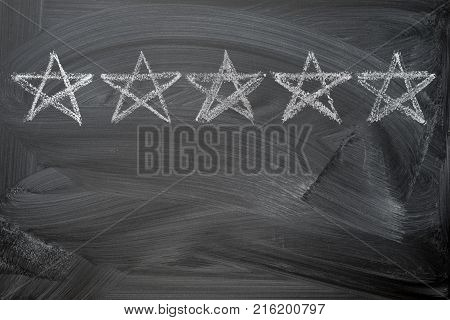 five stars rating on chalkboard with copy space