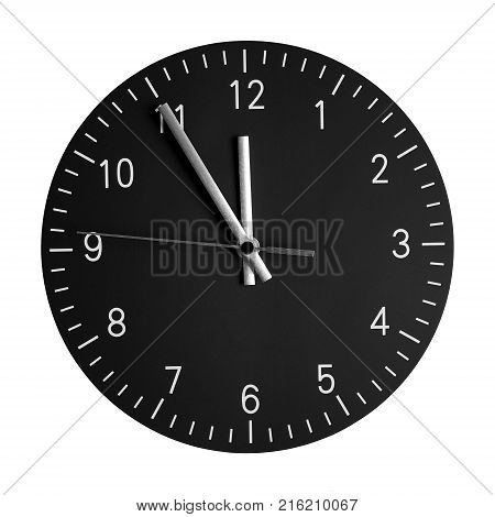 isolated wall clock with its hands at 5 to 12. concept for high time or 5 minutes to midnight.