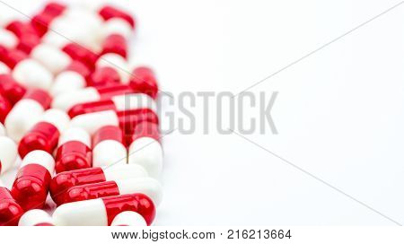 Selective focus of antibiotic capsules pills on white background with copy space. Drug resistance concept. Antibiotics drug use with reasonable and global healthcare concept.