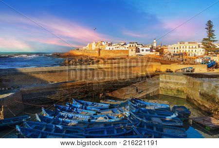 Fishing port and Essaouira town at the sunset time Morocco