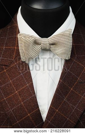 Stylish men's suit. Men's jacket on a mannequin. Men's Clothing. Mannequins in the window of the boutique. Clothing store. Shopping in boutiques.