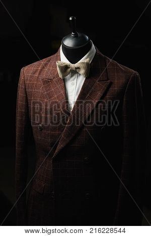 Stylish men's suit. Men's jacket on a mannequin. Men's Clothing. Mannequins in the window of the boutique. Clothing store. Shopping in boutiques.
