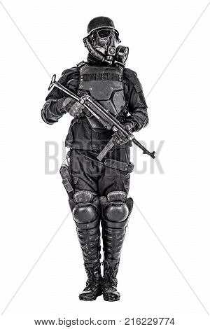 Futuristic nazi soldier gas mask and steel helmet with schmeisser handgun isolated on white studio shot
