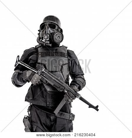 Futuristic nazi soldier gas mask and steel helmet with schmeisser handgun isolated on white studio shot half length portrait