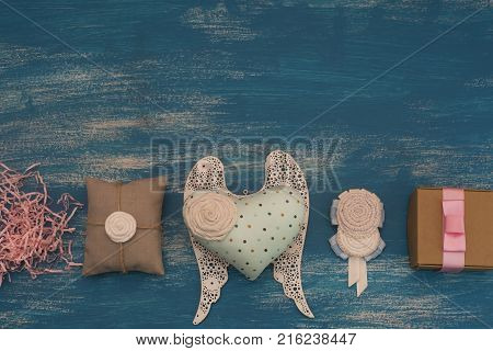 Decorative composition holiday boxes with gifts. Womens costume jewelry flowers. Flat lay