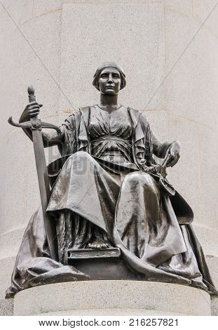 Adelaide SA Australia - November 20 2009: Black bronze statue of Woman with Sword and scales represeants Justice at Monumental statue of King Edward VII.
